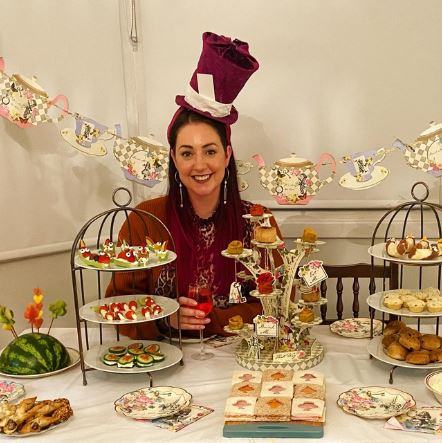 The Art Of Being Alone Is A Skill.
Let's Make Today A Good Day. Picture of pretty girl holding a  Mad Hatters Tea Party.