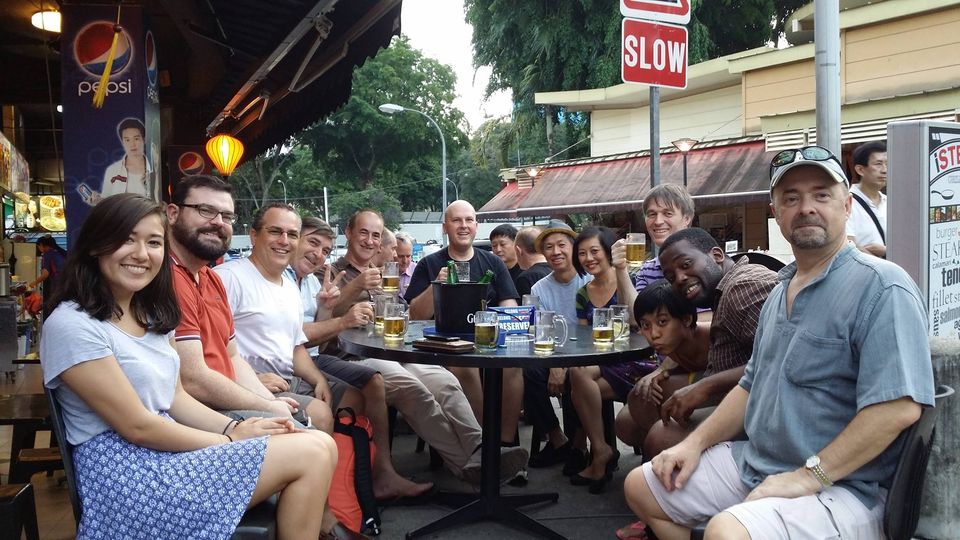 The art of having company. Picture of Stephen Warrilow Zen Tools author with a group of friends at a street bar in Singapore.