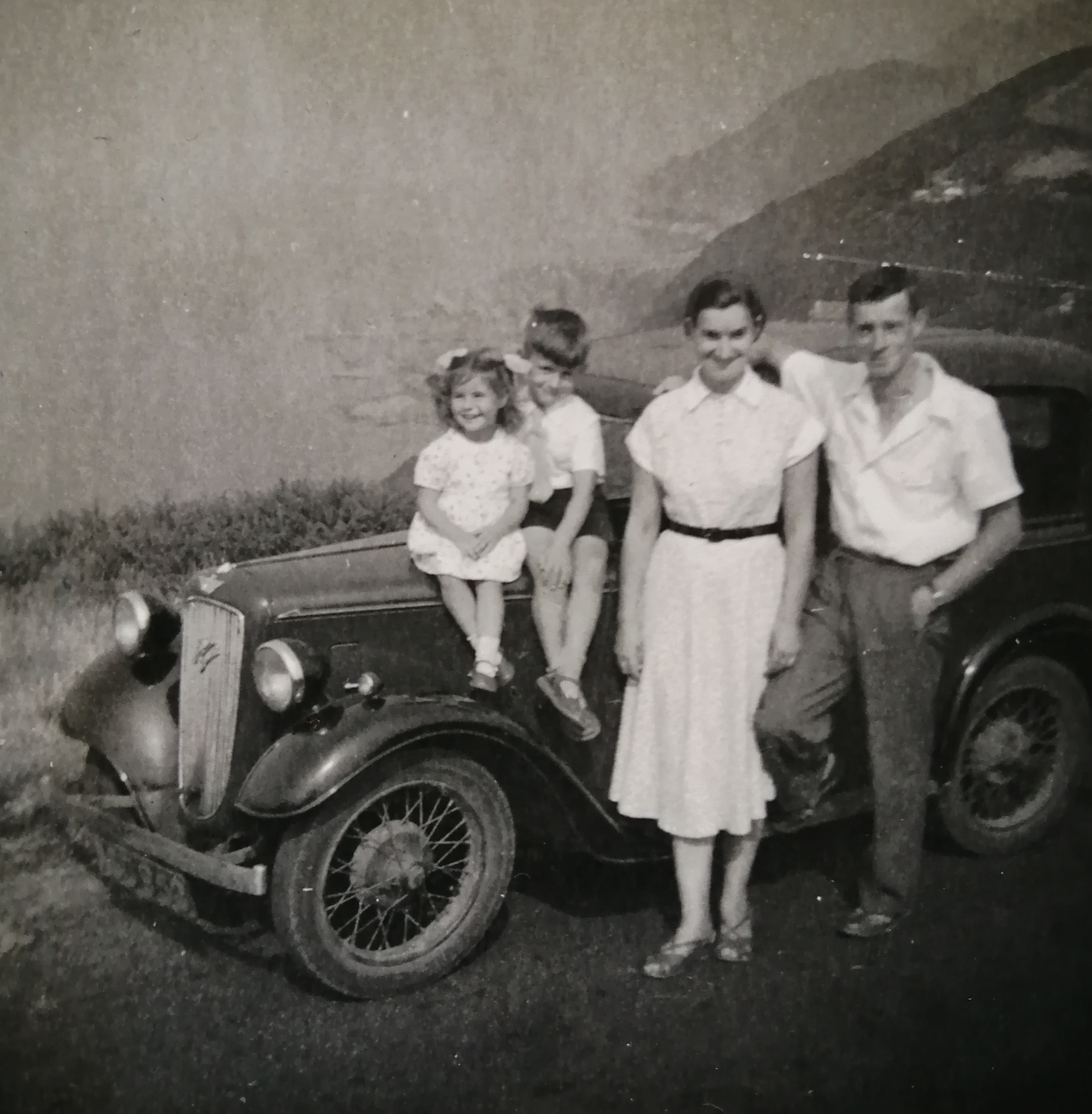 Picture of author and his sister as children with their parents.