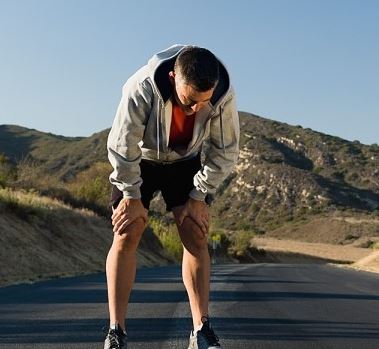 Going The Extra Mile - The Power Of One More. Life is non-linear, which makes the rewards of continued effort disproportionately big. Picture of an exhausted runner at the end of a long race.