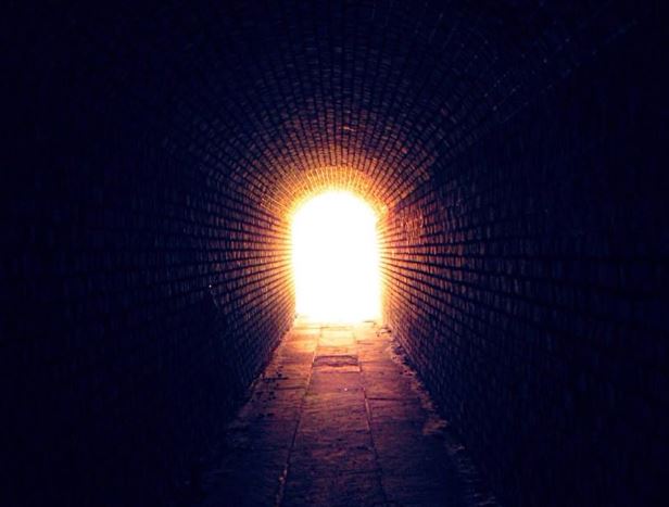 Be The Light At The End Of Someone Else's Tunnel. Picture of the daylight at the end of a railway tunnel.