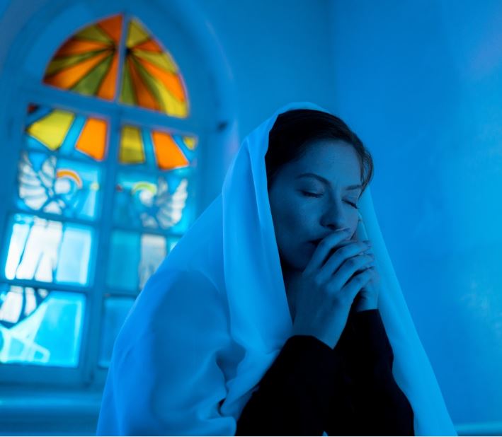 Definition Of Belief - 
Understanding The Structure & Types Of Beliefs. Image of a woman praying in church.