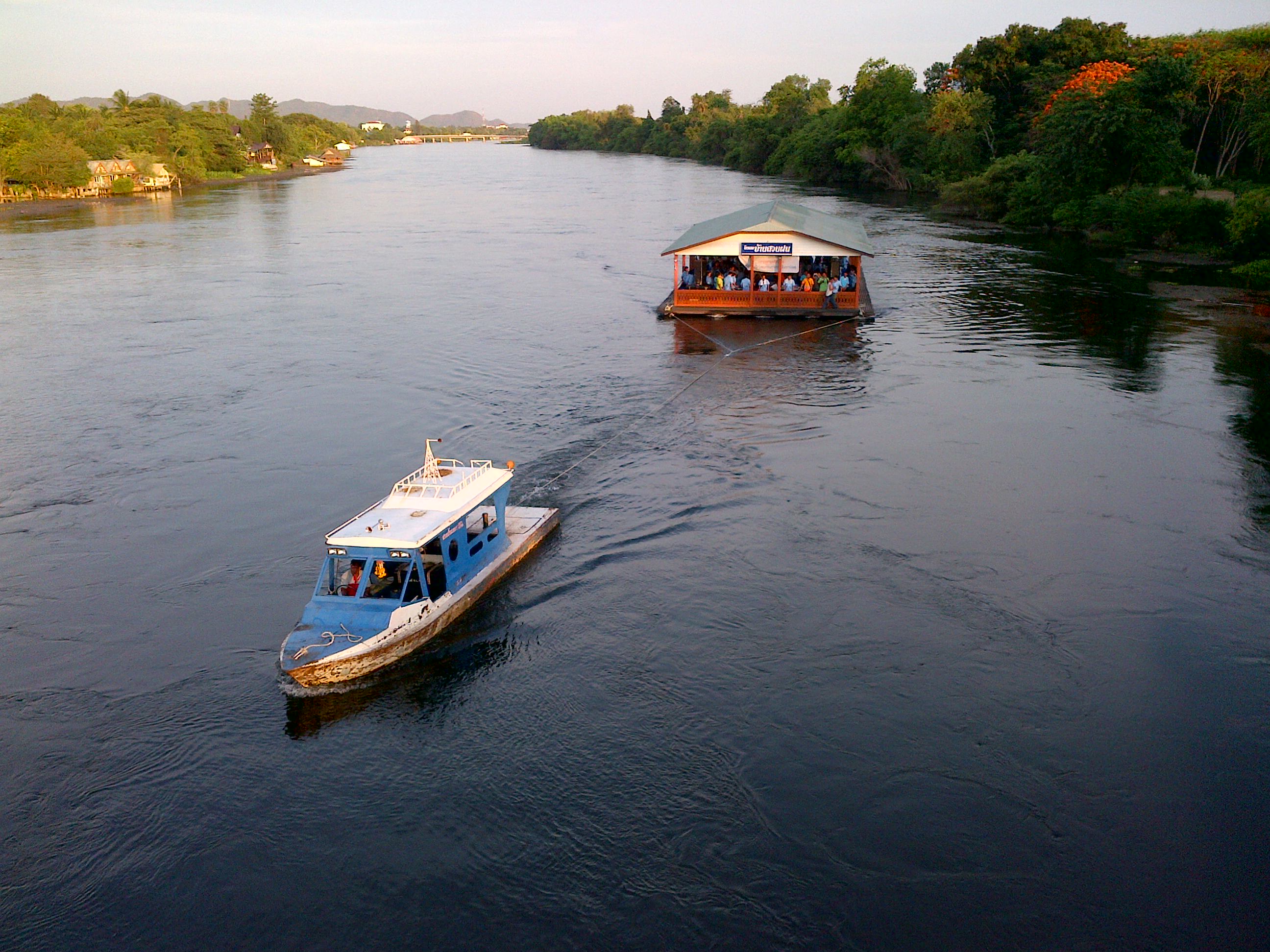 On Becoming The Ferryman. The Art Of Living Is Knowing How To Make Use Of Suffering. Photo of a large ferryboat transport people across a river.