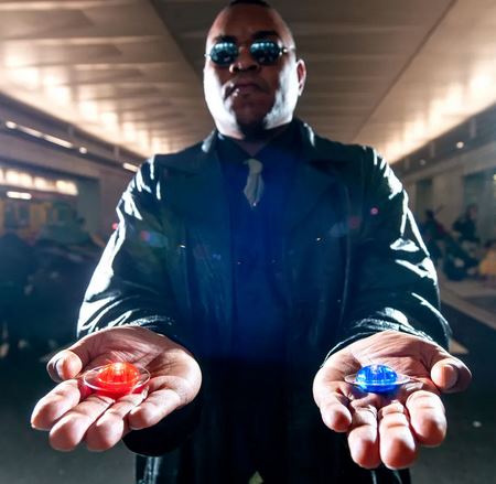 The Red Pill - This Is What Will Happen After You Take It. Picture of Morpheus in the film "The Matrix" with a red pill in one hand and a blue pill in the other hand.
