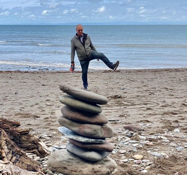 The Balanced Life - an optical illusion suggesting a man balancing on a pile of stones.